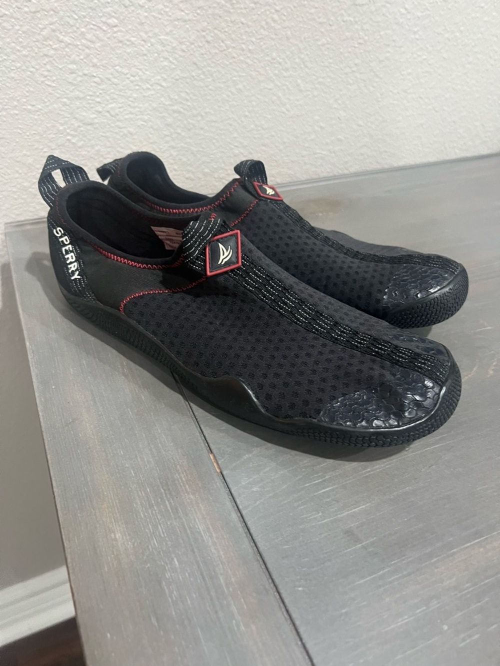 Sperry Black Men’s Slip-On Water Shoes with Red Stitching